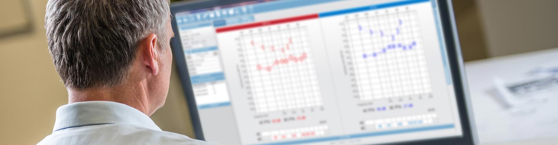 A clinician reviewing audiometry testing results
