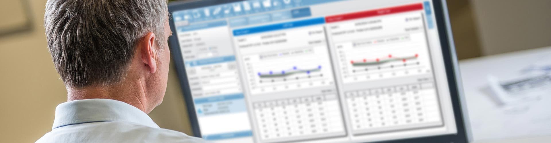 A clinician reviewing otoacoustic emissions test data